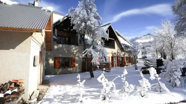 Wooden houses and snow-covered chalets in a mountain village