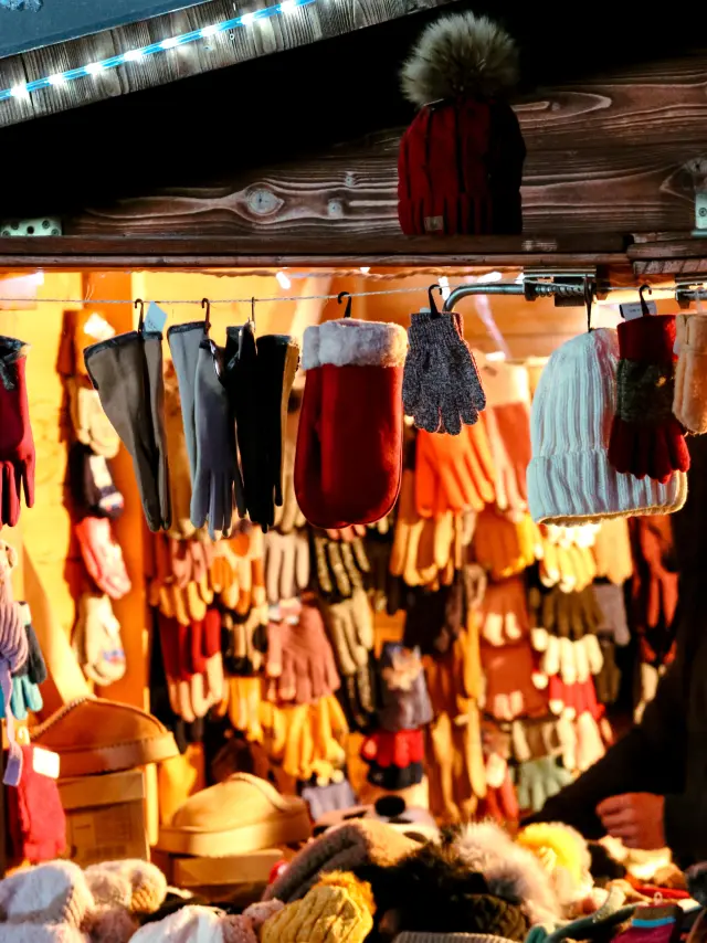 Shelves filled with hanging and stacked clothes in a shop