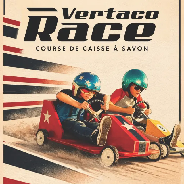 Two drivers in racing suits inside a red and orange soapbox car on a race track
